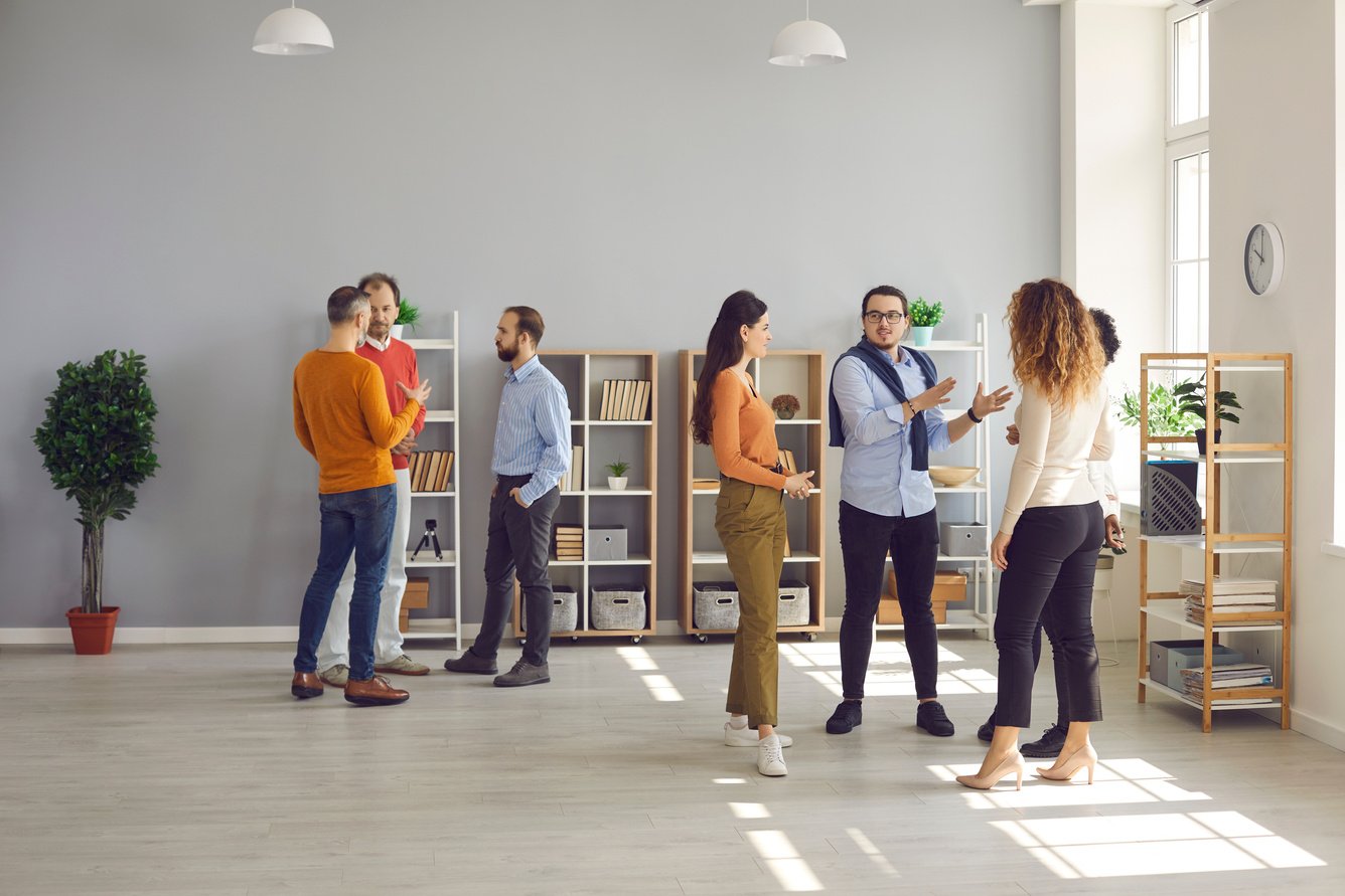 Diverse People Communicating at Business Networking Event in Modern Office Workspace